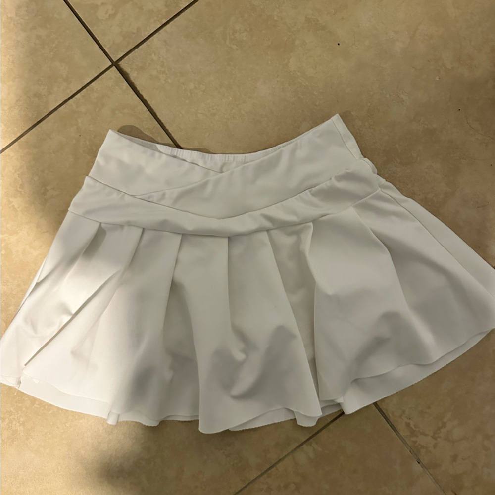 white crossover tennis skirt